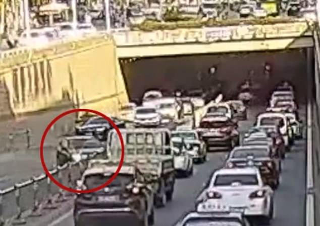 Shocking footage of a November 2018 incident in Anhui, China shows a purple Mercedes Benz slamming through a road barrier twice in a dramatic zig-zag pattern near an underpass