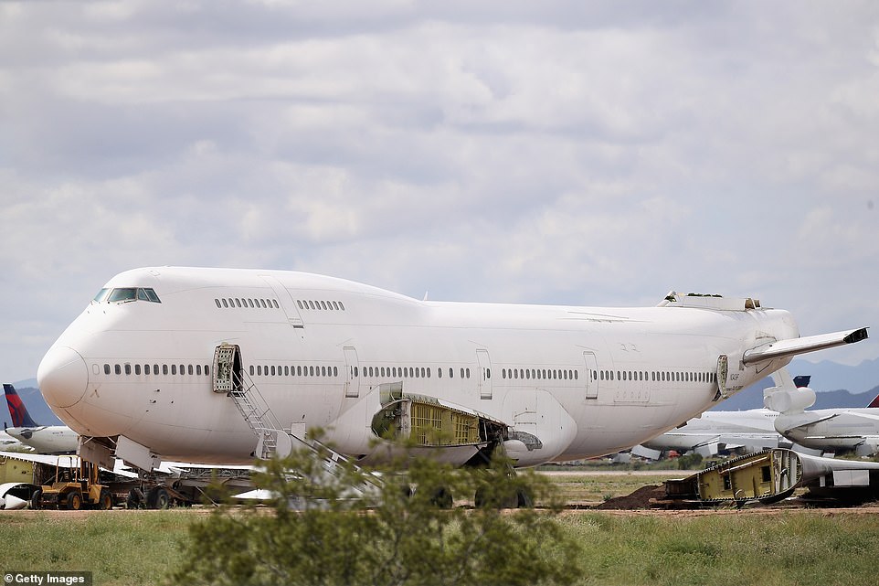 A decommissioned 747 is seen among various smaller planes at the Pinal Airpark, which is mainly used as a 'boneyard' for commercial planes