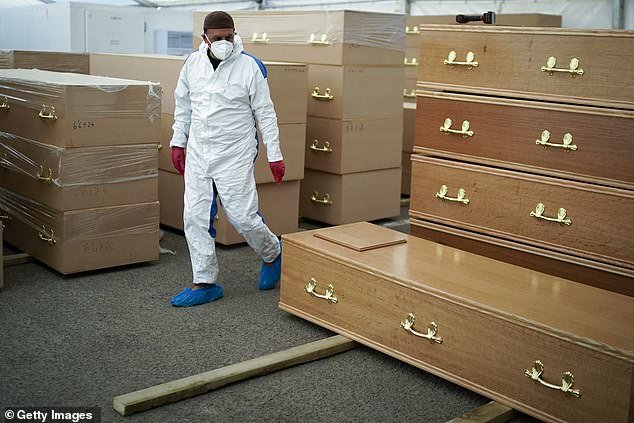 Dozens of coffins were seen stacked on top of each other inside the temporary mortuary in the West Midlands