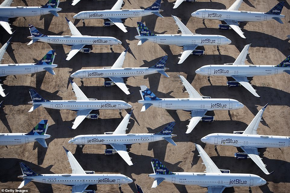 JetBlue planes sit idle on the tarmac waiting for the opportunity to take to the skies again
