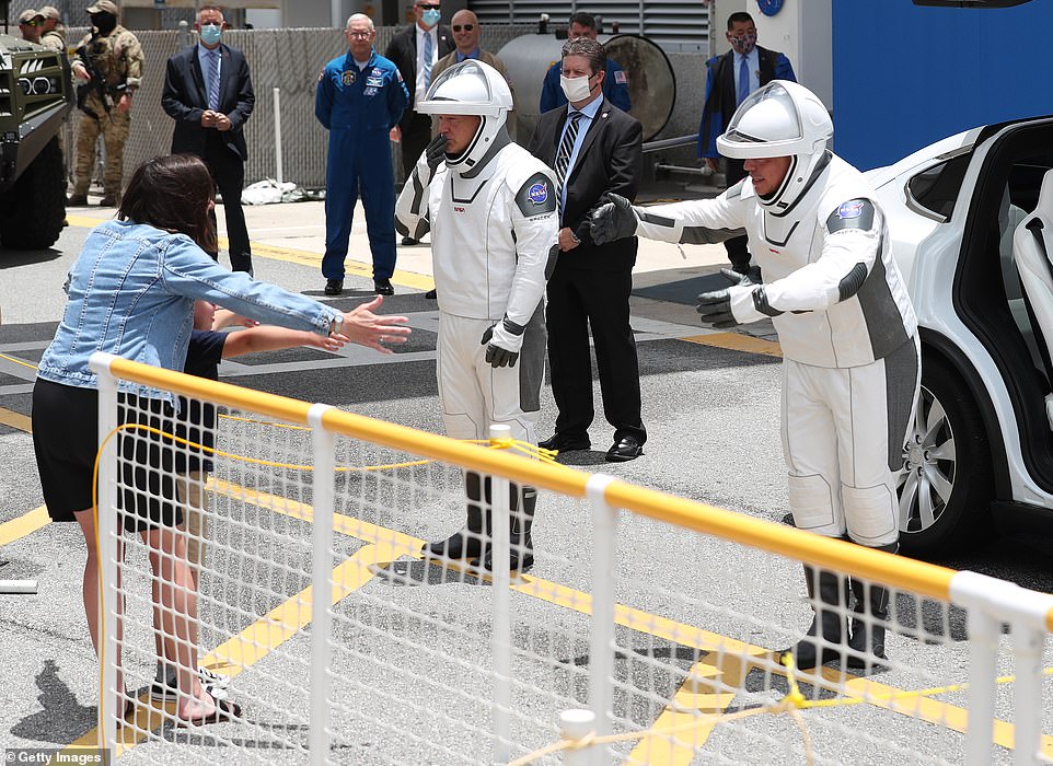 NASA astronauts Robert Behnken and Douglas Hurley arrived at Launch Complex 39A dressed in sleek one-piece tailor made space suits which have been designed specifically for use in the Dragon capsule. The pair was met by their families, who they could only 'air hug' due to the social distancing policy