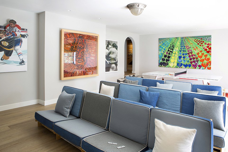 In the 100 years since, there have been only three owners but due to each having wildly different design tastes, there were numerous small rooms, different types of hardwood flooring, and an illogical floor plan. Pictured: A living room area after the space was renovated