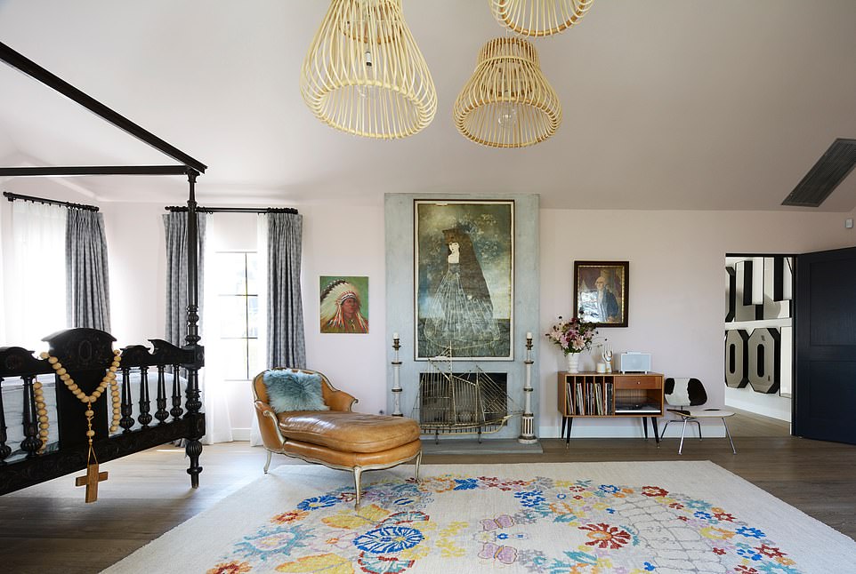 With the house feeling more like a maze of tiny rooms and multiple doorways, everything had to be gutted, redone and modernized by the designing duo. Pictured is one of the lavish looking guest bedrooms