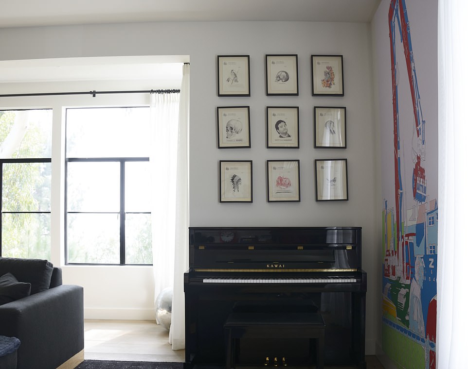 With an 'Old Hollywood' exterior, the castle features plenty of fairytale-like towers while offering a more contemporary feel inside - including plenty pieces of modern artwork (pictured above)