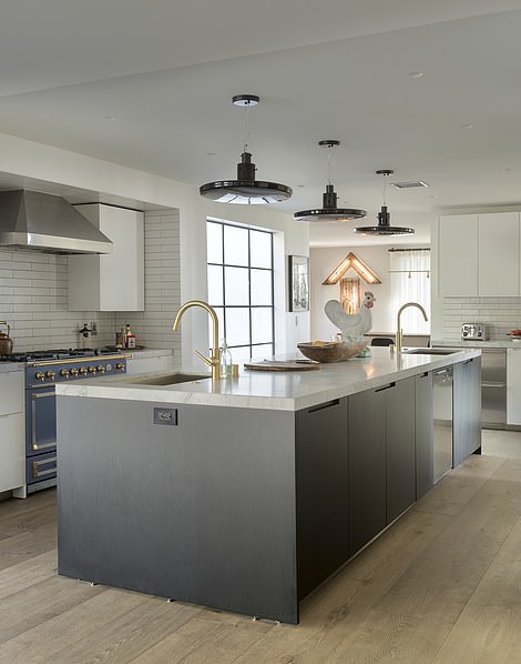 Robert and Cortney Novogratz, who have starred in two reality TV shows about their designs, renovated the LA home to a stunning modern mansion - complete with a contemporary kitchen (pictured)