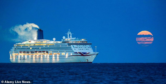 The government had previously urged over-70s to avoid sailings. Pictured: The July full moon rises over the P&O ship Aurora this week