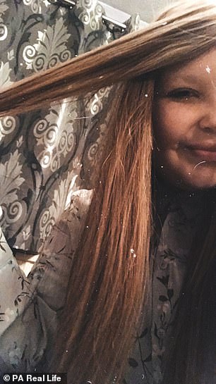 Kira wearing a wig after her treatment