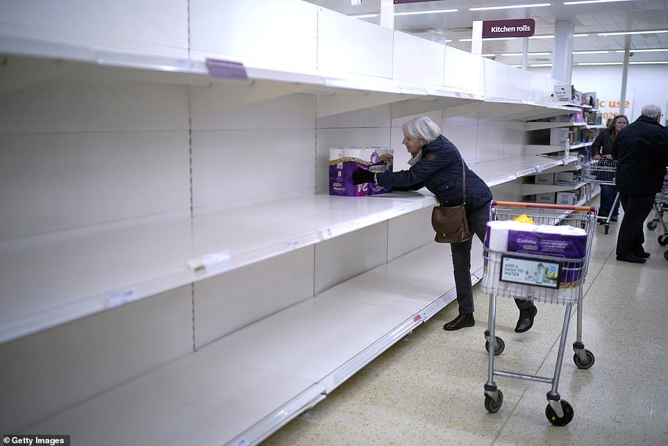 A senior citizen gets the last pack of toilet rolls at a Sainsbury's Supermarket on March 19, 2020, in Northwich. A spate of panic buying in March saw supermarket shelves stripped bare