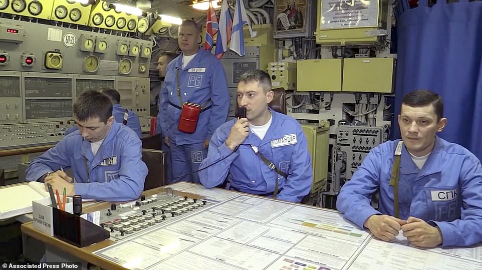 Russian Karelia nuclear submarine's crew work during manoeuvres on Wednesday 9 which included the launch of a ballistic missile from the Karelia nuclear submarine in the Barents Sea, Russia
