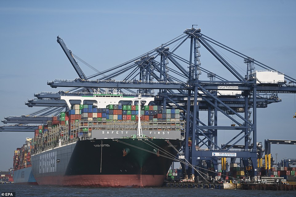 Containers are unloaded from one of the biggest ships in the world, Ever Gifted, at Felixstowe in Suffolk on Wednesday