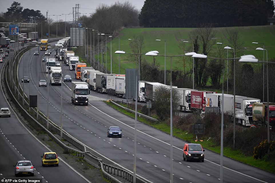 Lorries queue on the slip road leaving the M20 and joining a route to the Channel Tunnel freight terminal at Folkestone today