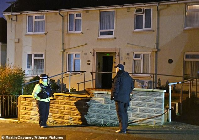 Police and forensic teams at the flat in Market Street, Pembroke Dock, after the body was found on February 20