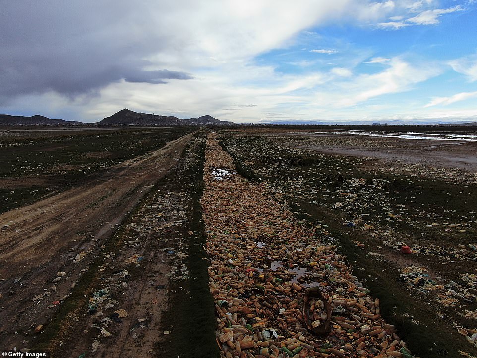 The nearly waterless polluted river has no outlet to the sea, so rubbish that has piled up in the lake in recent years is now stuck