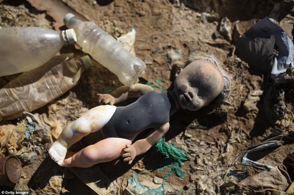 A discoloured doll, likely thrown into the Tagarette river outside Oruro, has washed up on the now mostly waterless basin of Lake Uru Uru