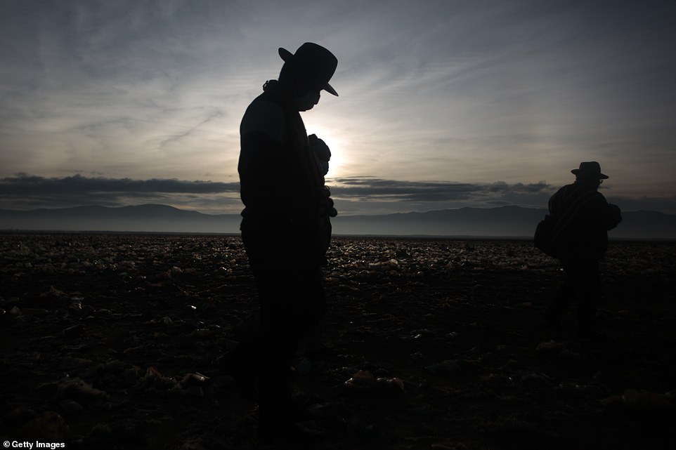 Nearby Lake Poopó is also struggling to mitigate the results of climate change, but has not faced the same issues of waste build-up as Lake Uru Uru (pictured, residents of villages near Lake Uru Uru)