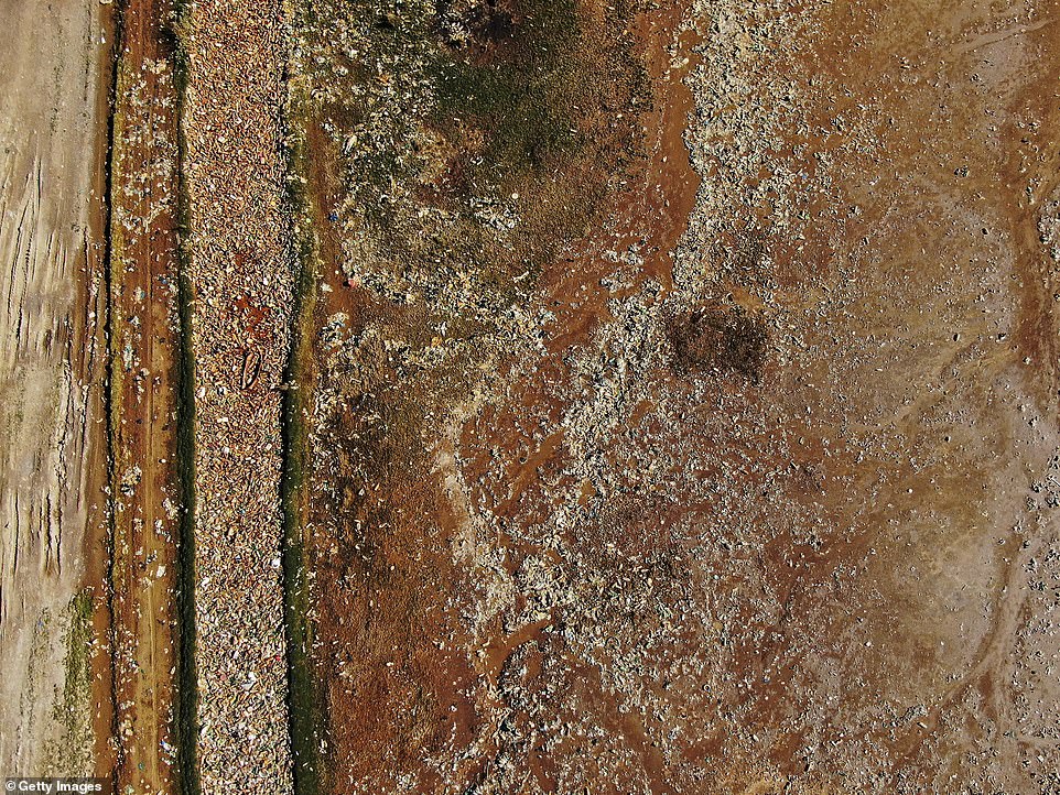 Tagarete river, where residents often dispose of their rubbish, has become clogged by garbage, plastics, and toxic waste