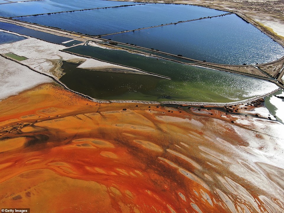 An aerial view of sewage water pools next to the contaminated area of Lake Uru Uru shows how much the colour of the resevoir's water has changed because of pollution