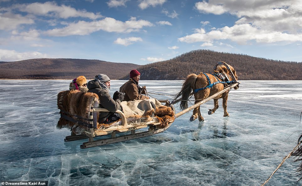 ICE SLEDGING, KHATGAL, LAKE KHOVSGOL, MONGOLIA: 'Two million years old and holding 0.5 per cent of the world’s fresh water, Lake Khovsgol freezes in winter temperatures of up to -50C,' writes Ford. 'The ice is strong enough to carry heavy trucks, although earlier transport routes installed on its surface are now forbidden to prevent pollution, with about 40 trucks having fallen through the ice. Happily, sledging and other activities are still enjoyed'