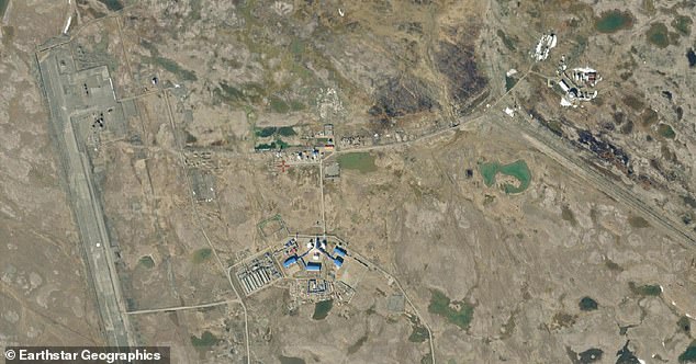 From revamping runways to deploying additional surveillance and air defence assets, the satellite images reveal a continuous effort to expand Moscow's capabilities in the polar region. Pictured: The runway lies to the west of the base