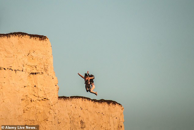 The two women were some of hundreds who flocked to the East Sussex beauty spot over the sunny Easter weekend