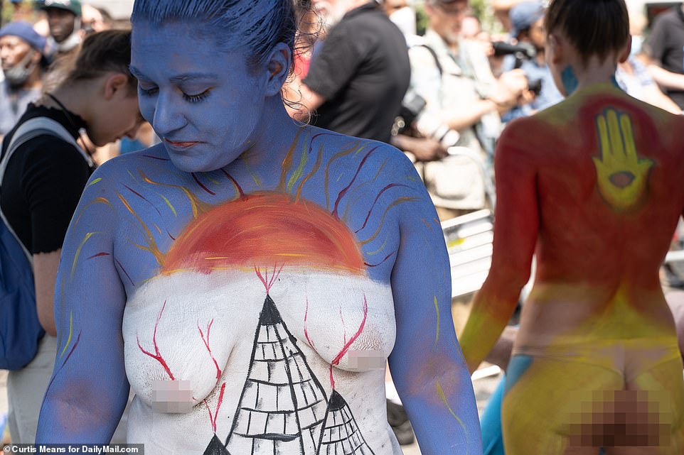 A fiery creation was painted on this woman's body with an eruption appearing to take place all over her