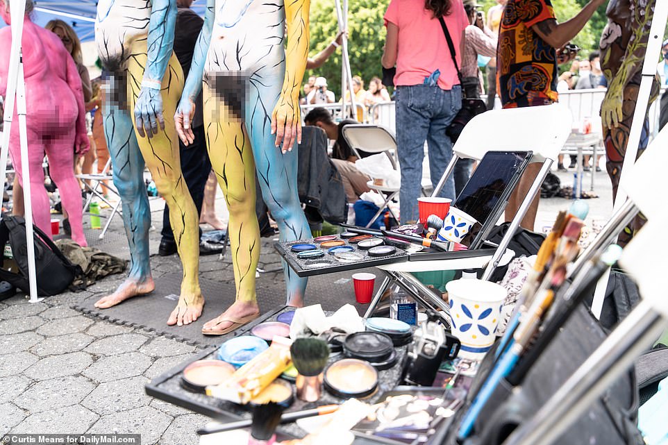 The artists painted several people with complementing body art that matched one another