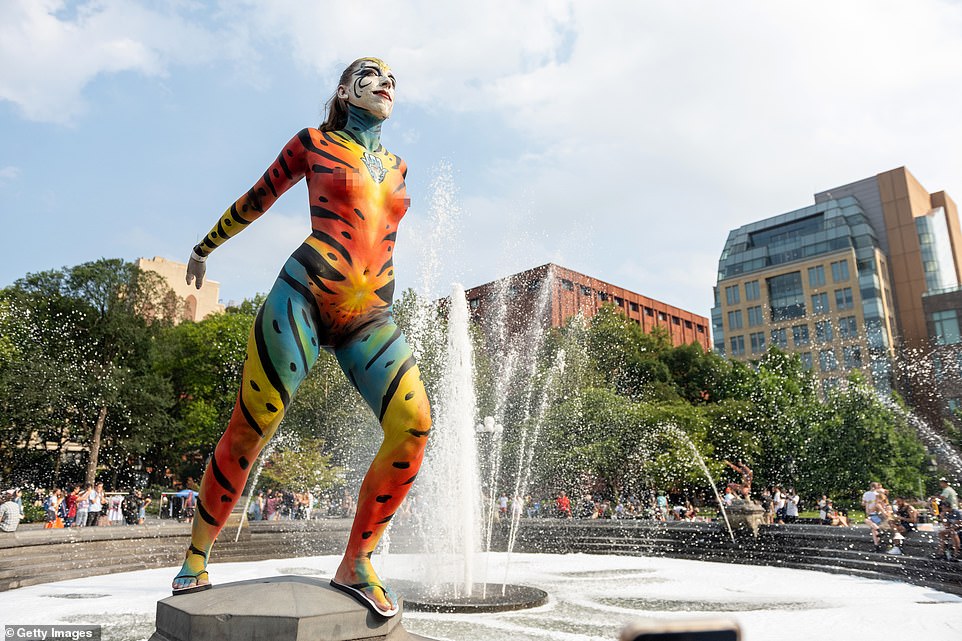 The march ended at Washington Square park with this woman posing in the fountain