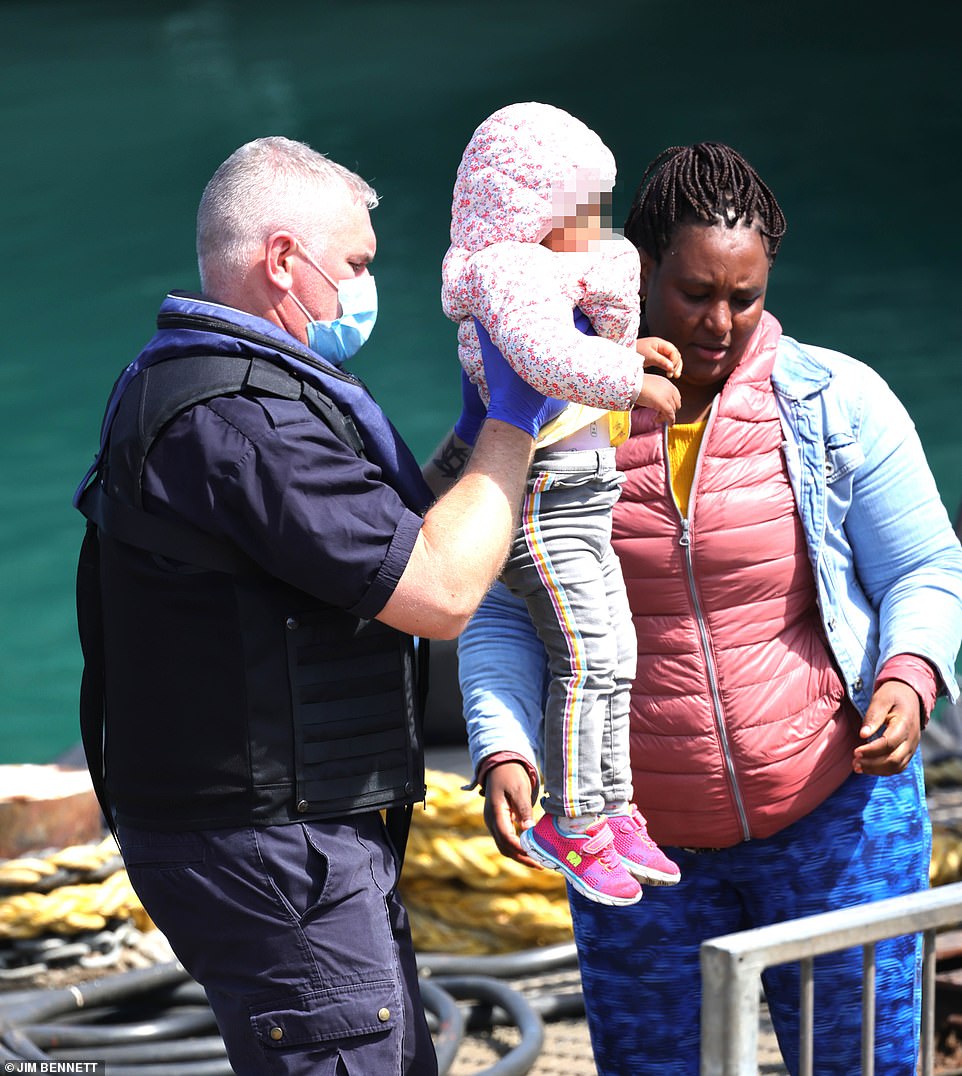 Very young children were spotted coming ashore with what appeared to be family members in Dover yesterday