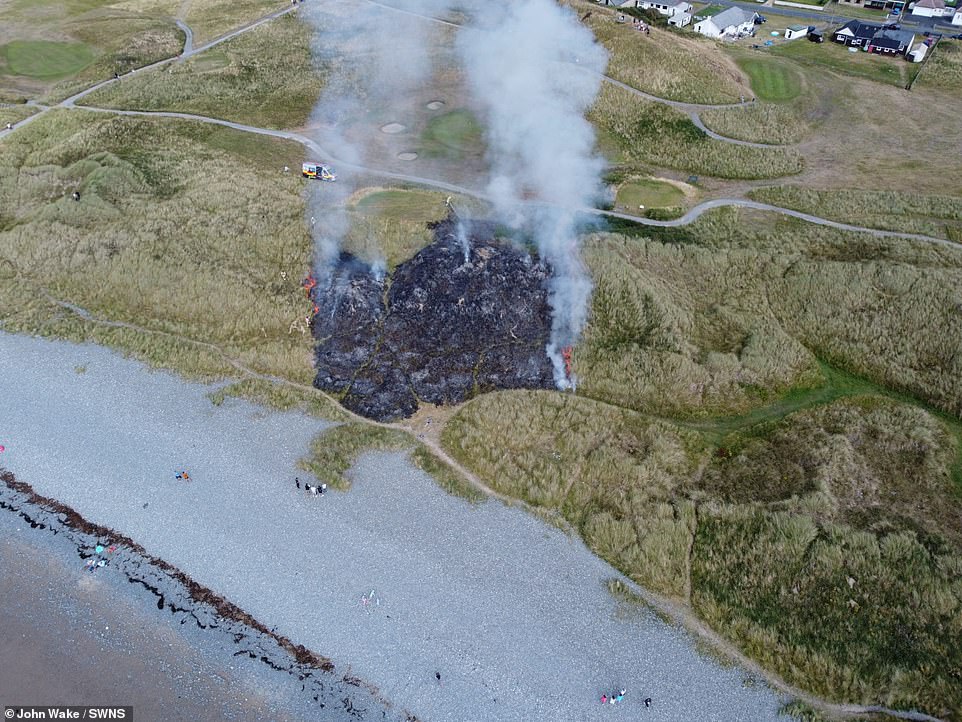 Sand dunes ablaze in the middle of Borth and Ynyslas Golf Course in Ceredigion, West Wales