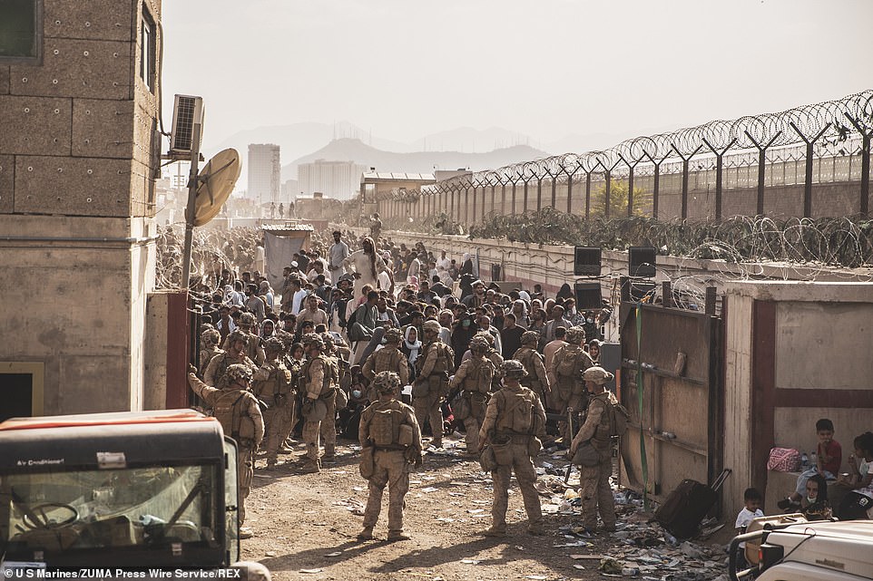 US marines man a checkpoint during evacuations at Hamid Karzai International Airport, Kabul, on Monday