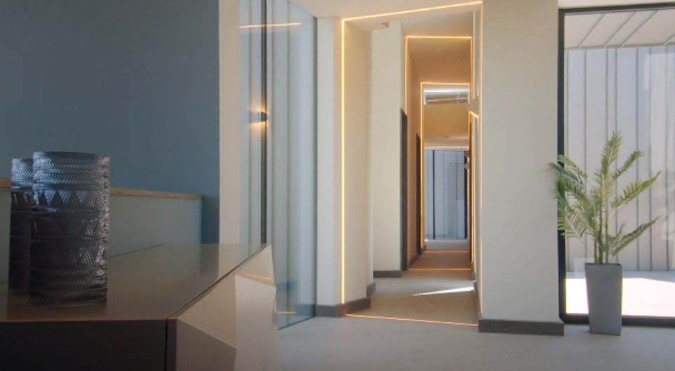 Once inside, the shock of the hard exterior is muted with pastel colours and sublime interior design, including a spaceship like corridor of lights