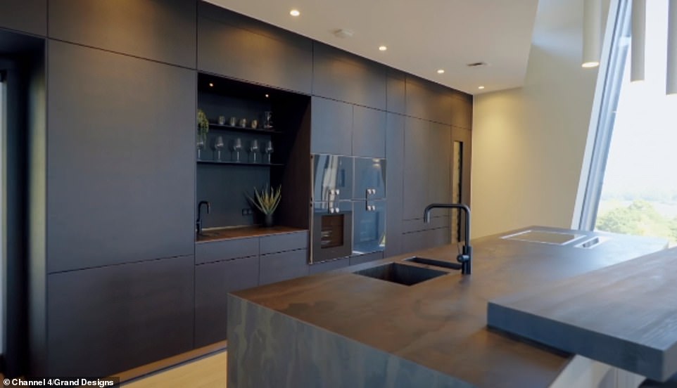 After starting the project in 2017, the couple's build was hampered by difficulties from the outset, including issues with the timber frame, challenges installing 46 panes of glass costing £200,000, poor weather and the Covid-19 crisis (pictured, the £125,000 kitchen)