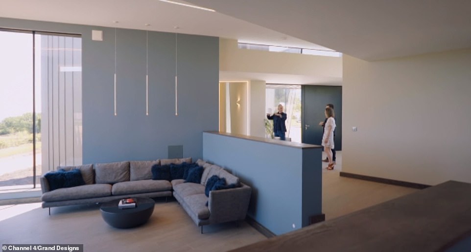 With three children in tow, the couple have done their best to keep the home cosy, and its angular windows provide a serene setting for the parents, and a playground full of endless possibilities for their kids