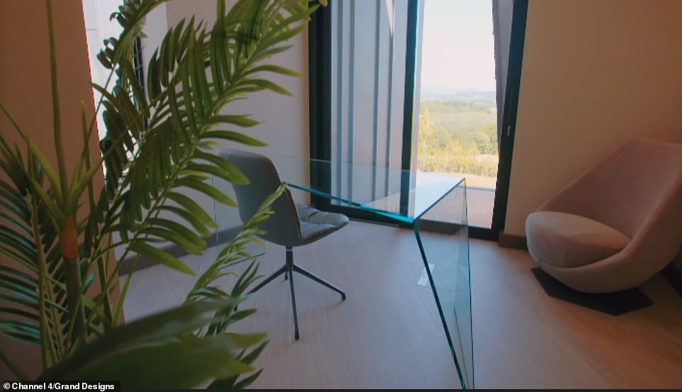 Meanwhile an office space in one of the rooms is decorated sparsely, but offers an incredible view of the Devonshire countryside from its huge window