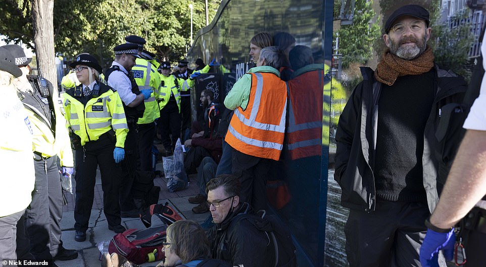 Insulate Britain protesters sitting on the side of the A12, Poplar, leading to the Blackwall Tunnel