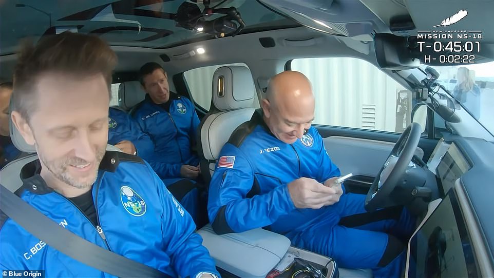 The crew was taken to the launch tower in a Rivian pickup truck, which was driven by Bezos