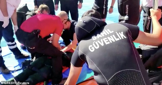 The video shows one of the gliders being carried away in a stretcher