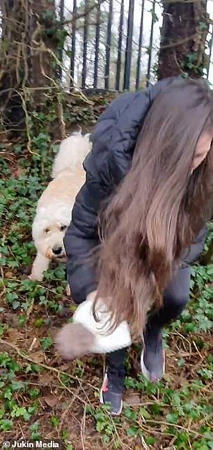 The pooch is told 'drop it Leo!' by the filmer and as her sister finally retrieves her hat she says: 'Good boy'