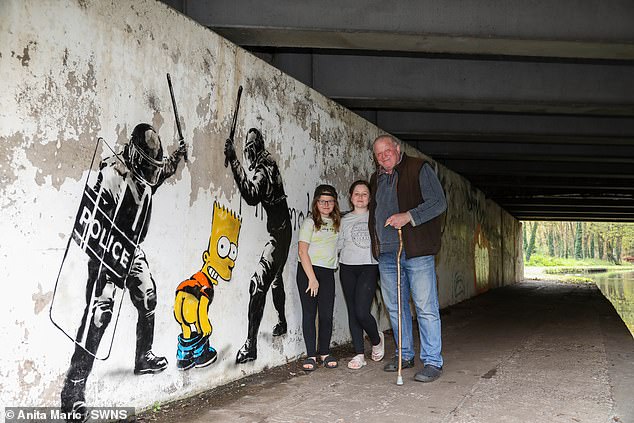 The dad of two posed for pictures in front of the stencil artwork. He was diagnosed with MSA last month