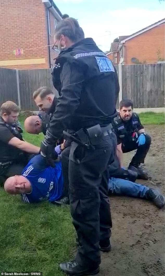 Three police cars pulled up outside Mr Meekcom's home in Kidderminster, Worcestershire, and he was later wrestled to the ground by six officers during the arrest in his back garden
