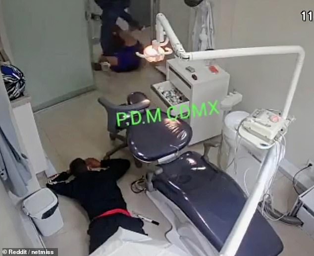 The second thief tries to grab the officer's gun but he too ends up being hurled onto the ground