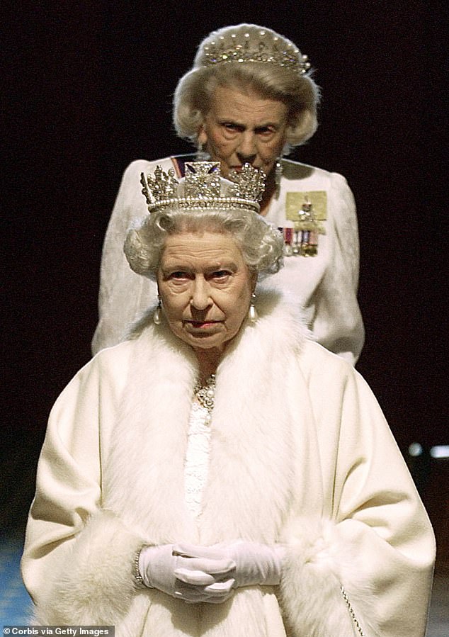Queen Elizabeth II, followed by her Lady-in-Waiting, the Duchess of Grafton, arrive at the House of Lords for the State Opening of Parliament