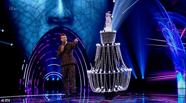 Who's that? British soul singer, 56, shocked the judges after she removed her costume and told how she had always wanted to 'give the show a go' as it looks 'so much fun'