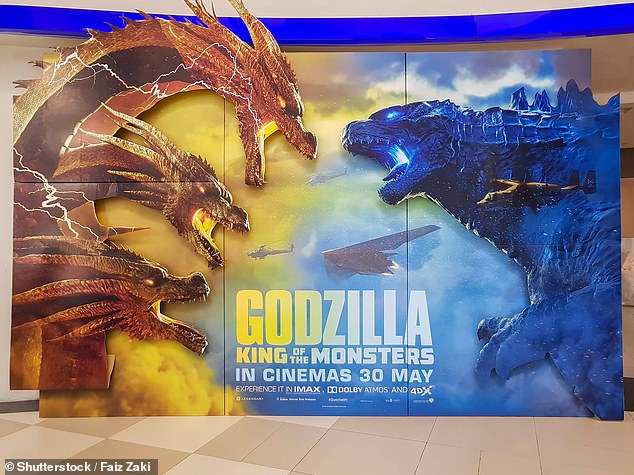 Found on Japan's Sado Island, Ramisyllis kingghidorahi was described by an international team of researchers led from the University of Göttingen. Pictured: King Ghidorah, left, with Godzilla, right, on a poster for the 2019 film 'Godzilla: King of the Monsters'