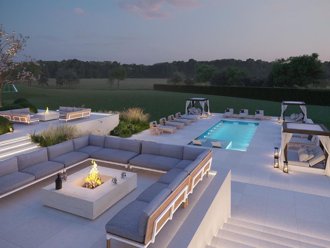 He also showed the rear pool showing a firepit towering above the glistening pool