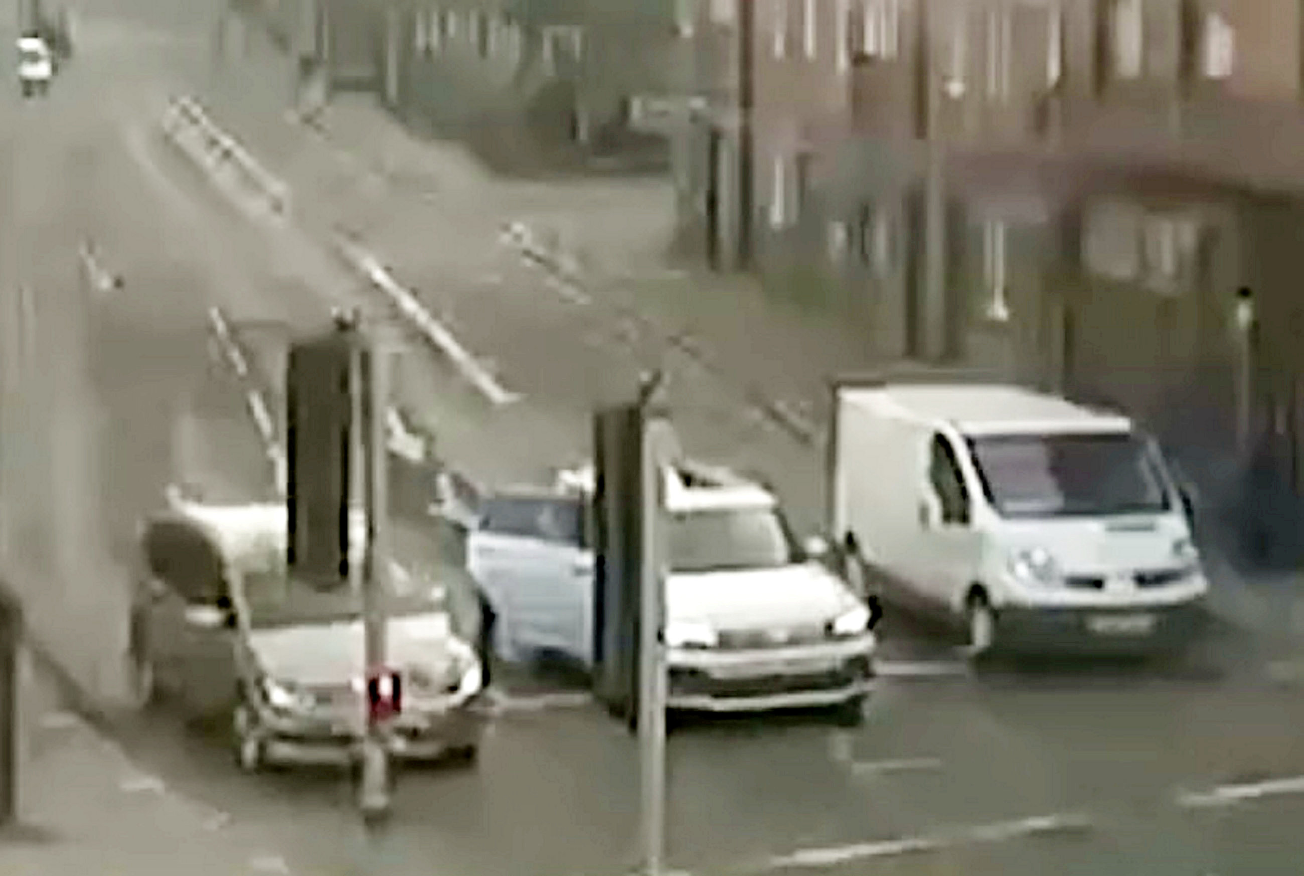 He loitered in a blindspot of the woman's rear view mirror