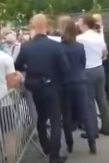 But Macron appeared to return to the crowd flanked by cops and security guards